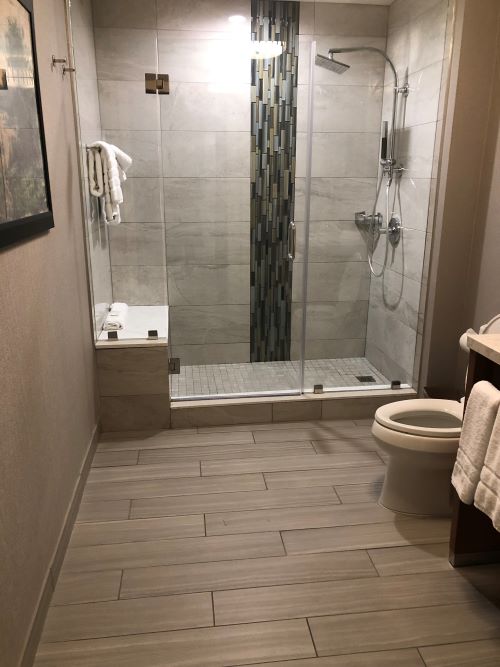 Custom tile shower in greys and neutrals. 